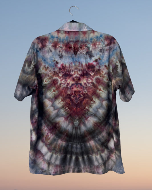 Tie-dye shirt on a hanger with a gradient background