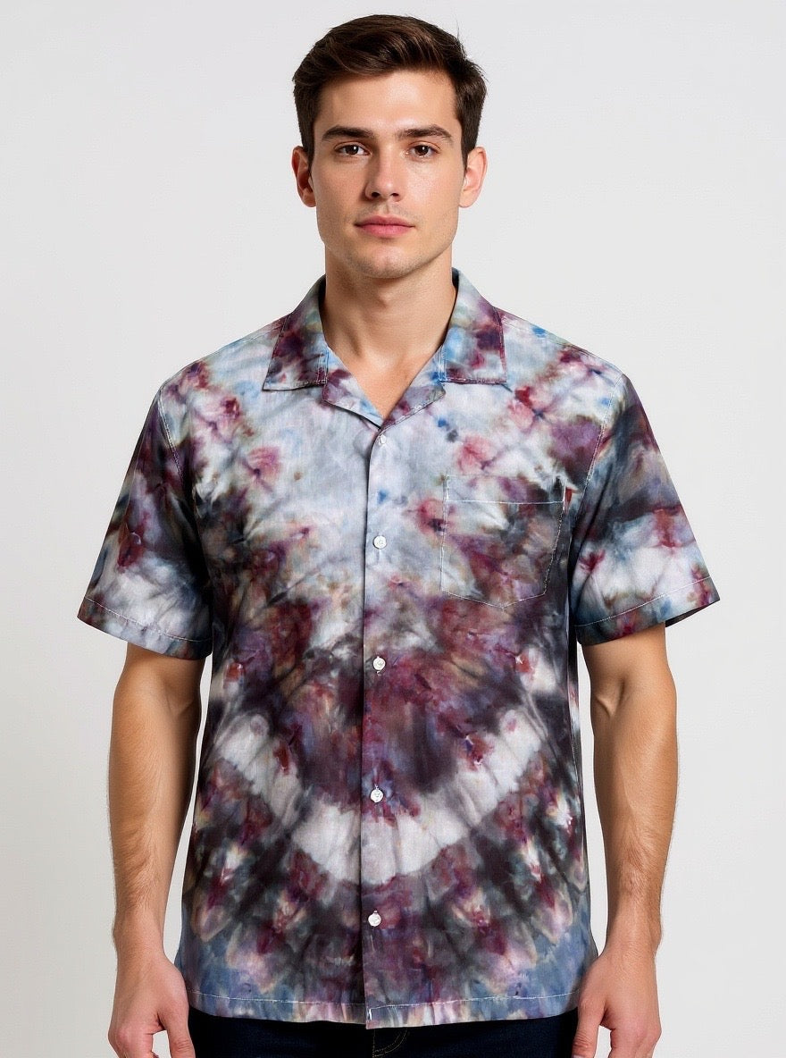 Man wearing a tie-dye shirt with a white background