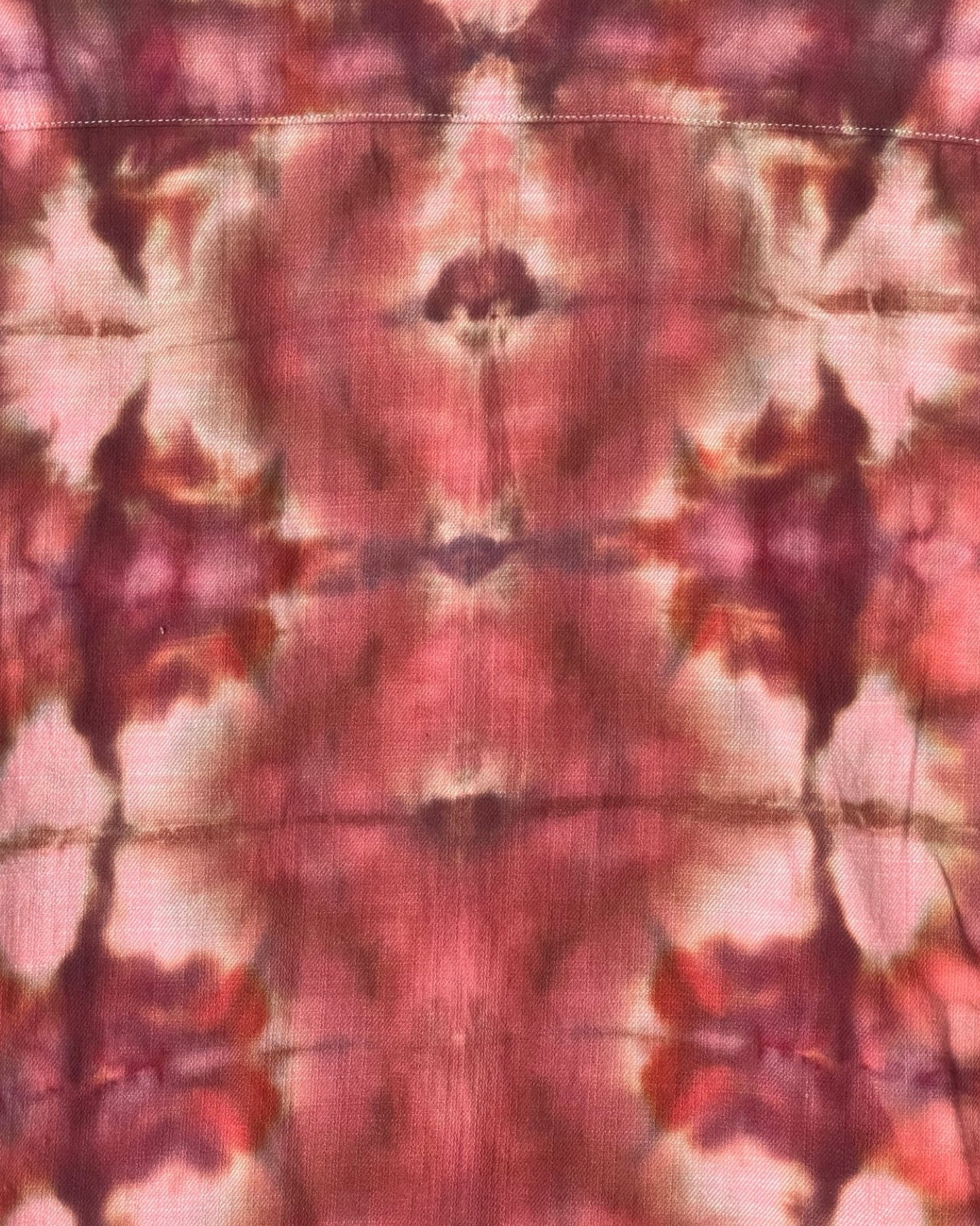 Abstract tie-dye pattern with pink and brown colors