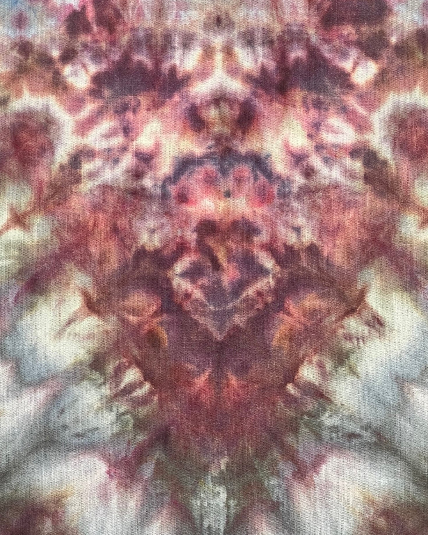 Abstract tie-dye pattern with multicolors on a fabric texture