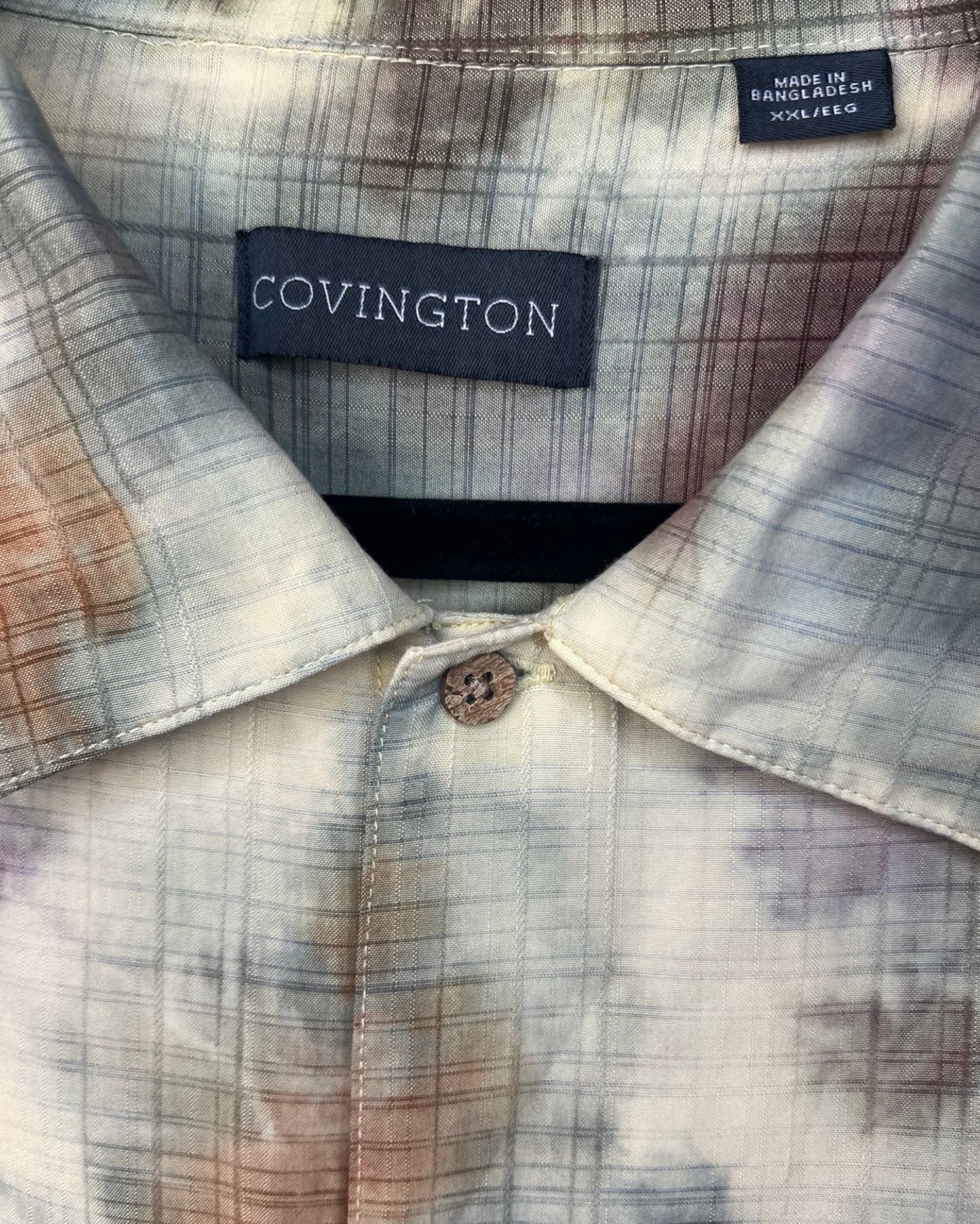 Close-up of a shirt collar with a visible brand label.