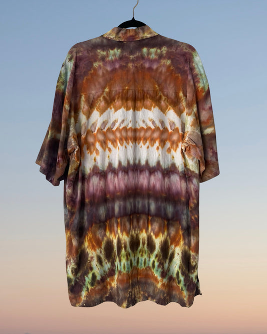 Tie-dye shirt on a hanger with a gradient background