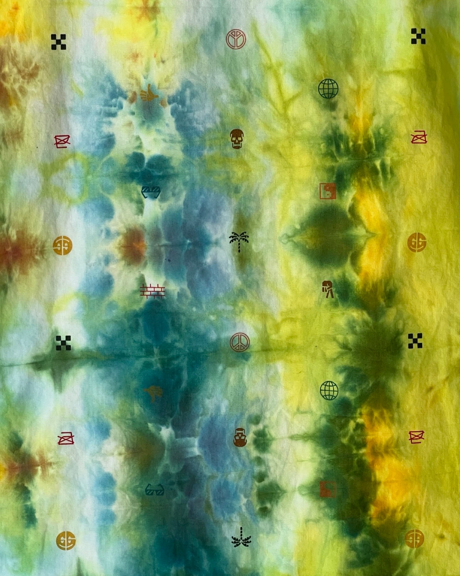 Abstract tie-dye pattern with green, blue, and yellow colors.
