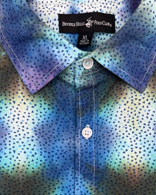 Close-up of a shirt with a colorful pattern brand name label.