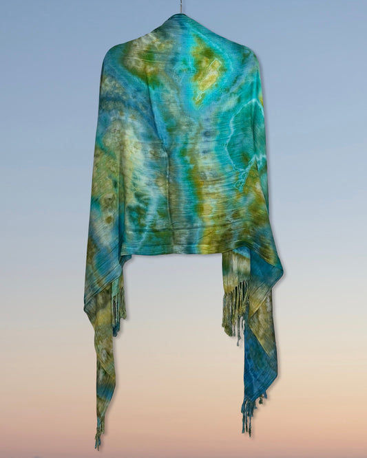 Tie-dye shawl with fringes on a gradient background