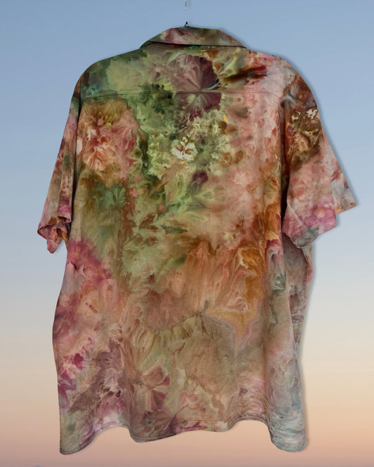 Floral patterned ice dyed shirt on a plain background