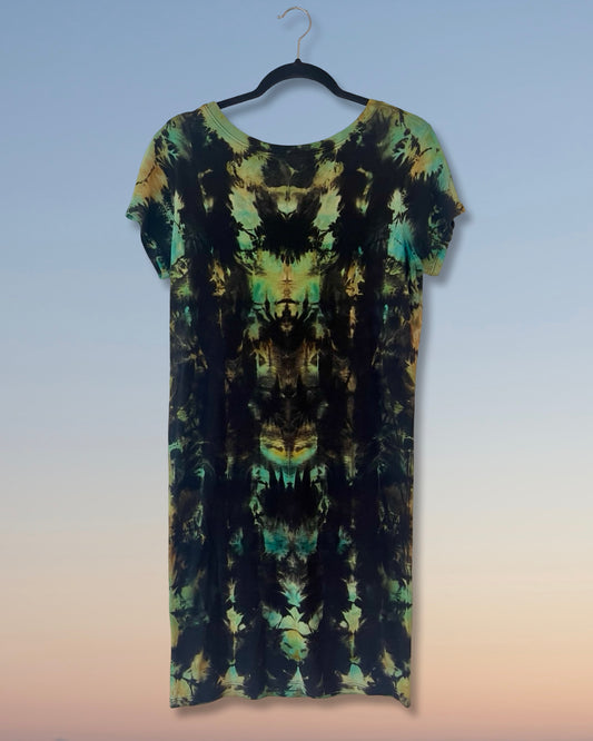 Tie-dye dress on a hanger against a gradient background