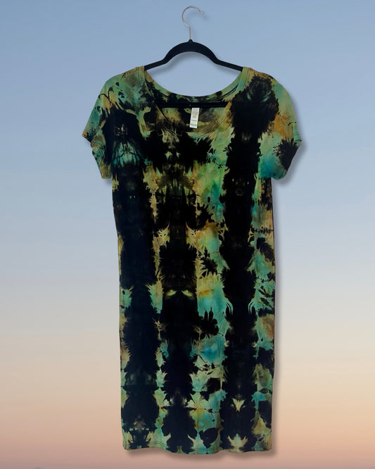 Tie-dye dress on a hanger against a gradient background