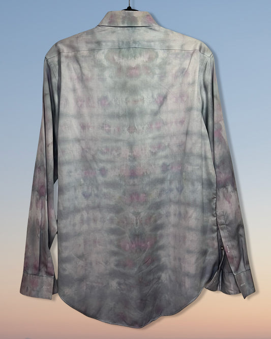 Long-sleeve shirt with a subtle tie dyepattern on a gradient background