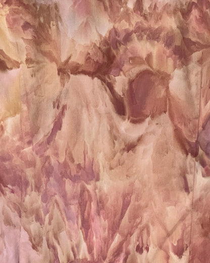 Abstract  ice dyed art with soft, blended colors in shades of pink, beige, and brown.