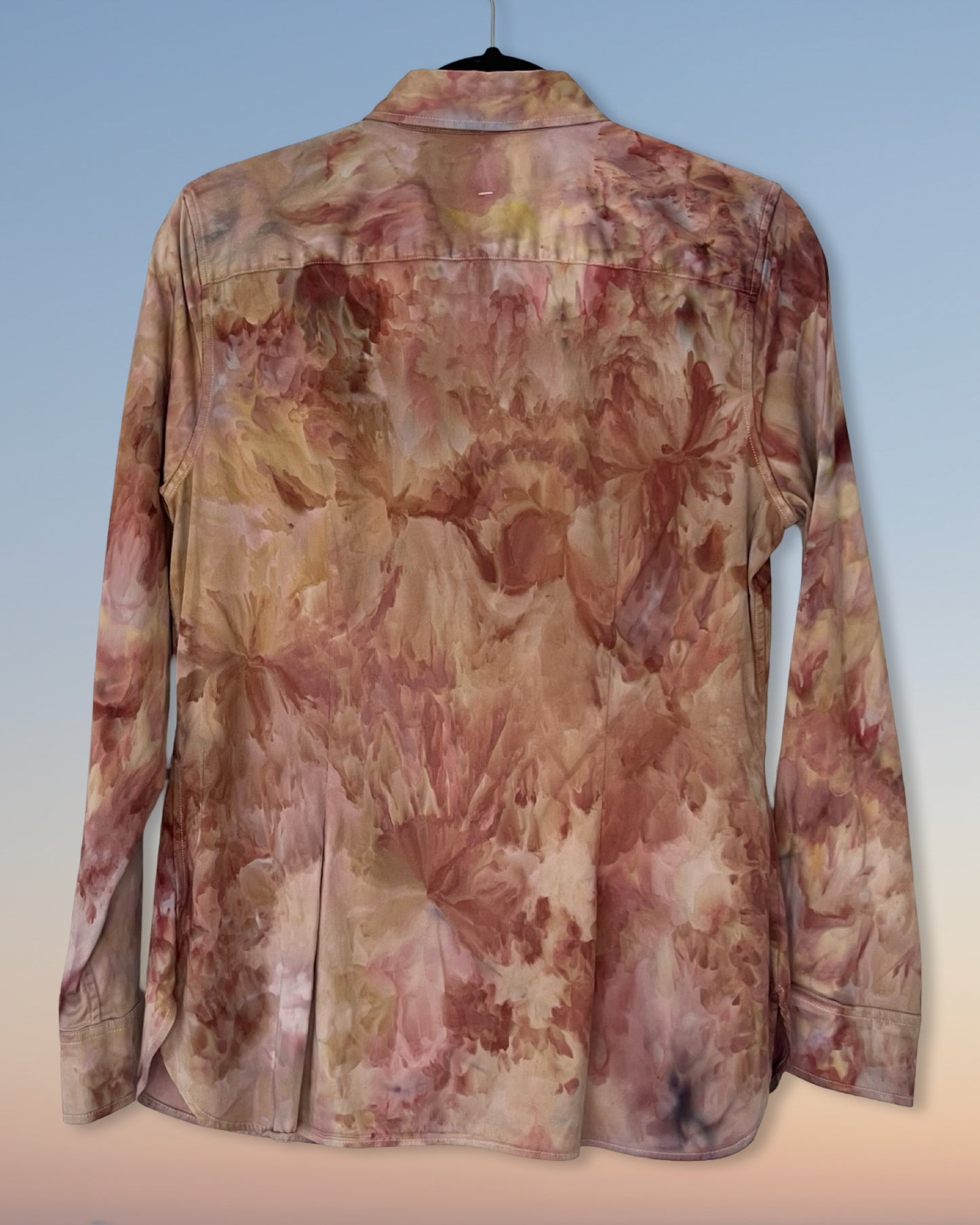 Floral ice dyed patterned shirt on a light blue background