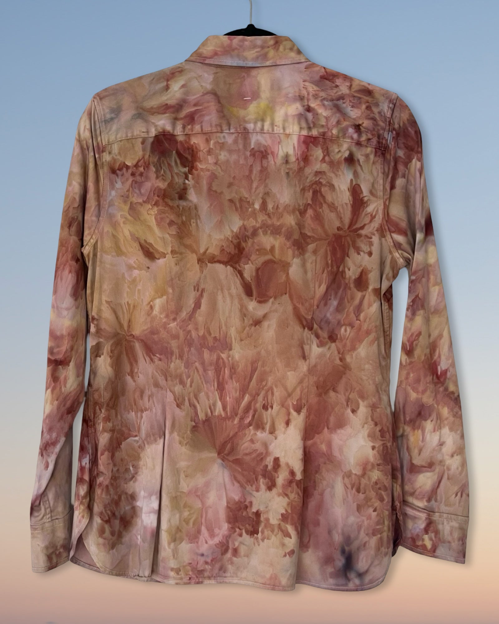 Floral ice dyed patterned shirt on a light blue background