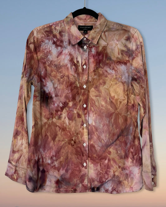 ice dyed shirt on a hanger with a gradient background