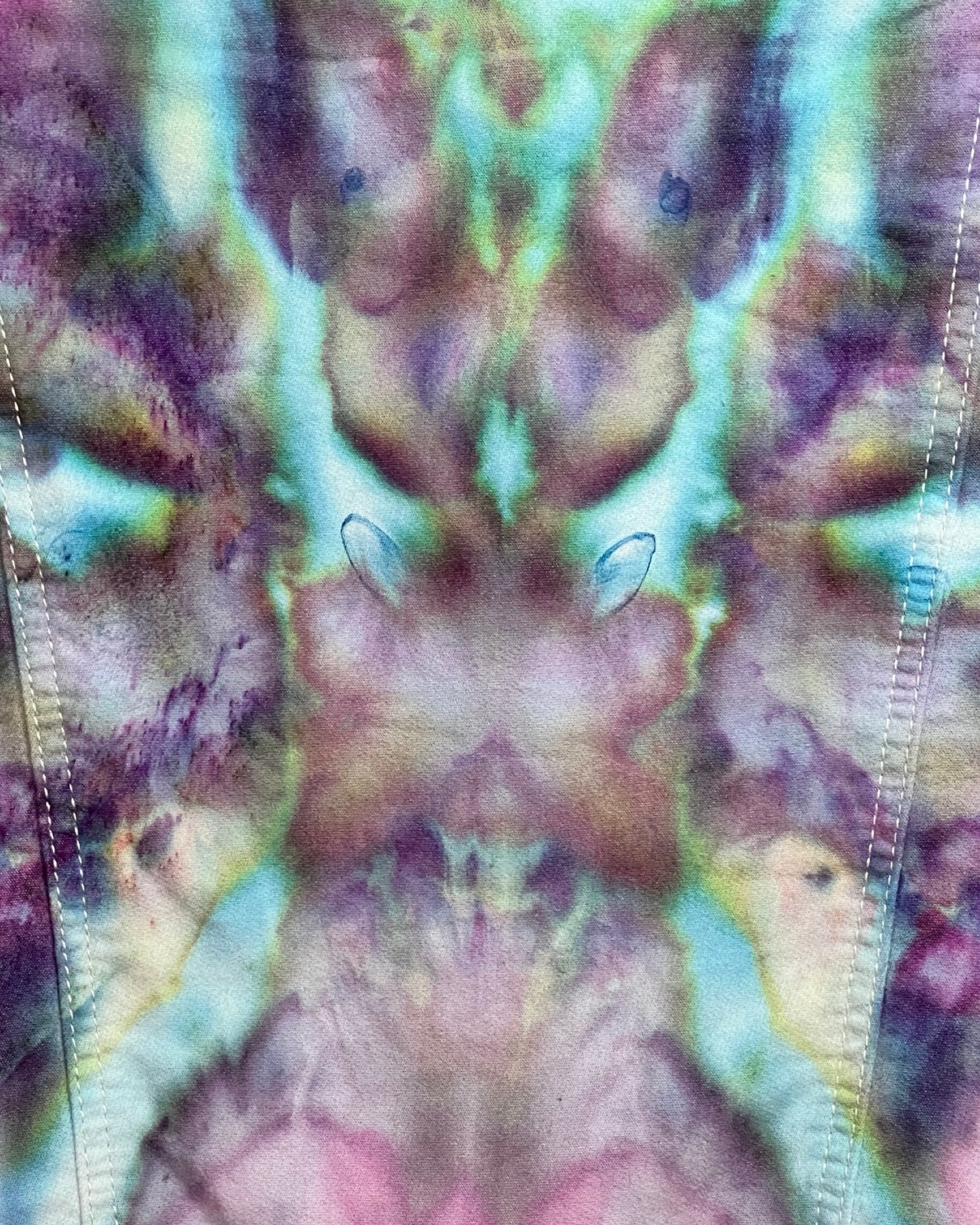 Close-up of tie-dye fabric with multicolor pattern
