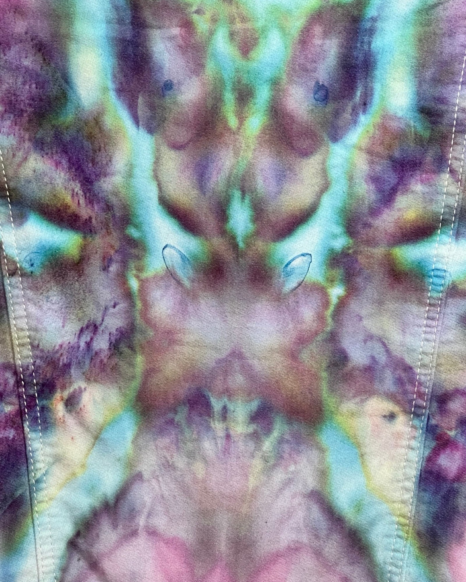 Close-up of tie-dye fabric with multicolor pattern