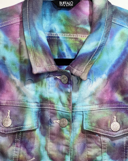 Tie-dye jacket with button details on a blurred background