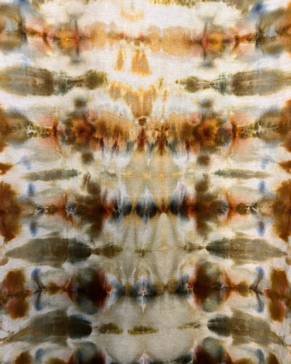 Tie-dye pattern with earthy tones on a fabric background