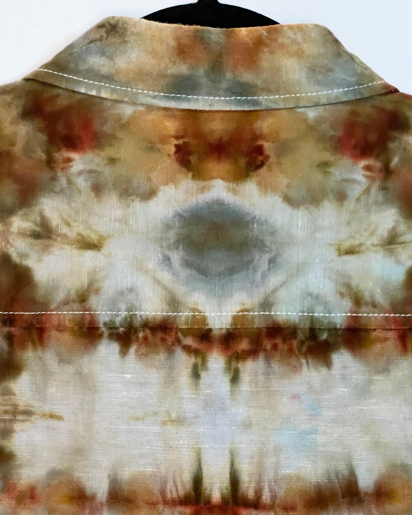 Tie-dye shirt with brown, beige, and white pattern