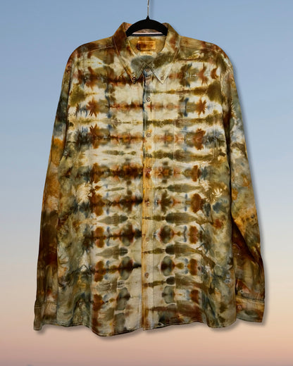 Tie-dye shirt with brown and beige pattern on a gradient background