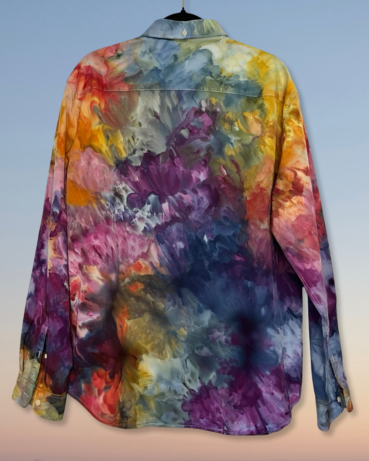Colorful tie-dye shirt on a plain background
