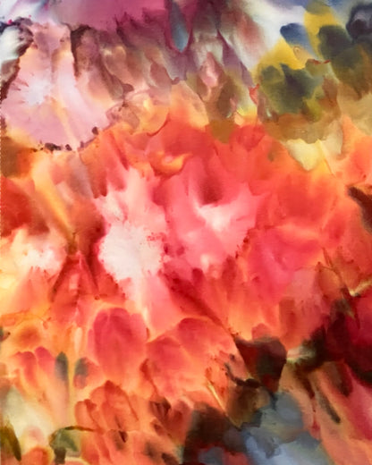 Abstract multicolored tie dye pattern with a focus on pink and orange tones.