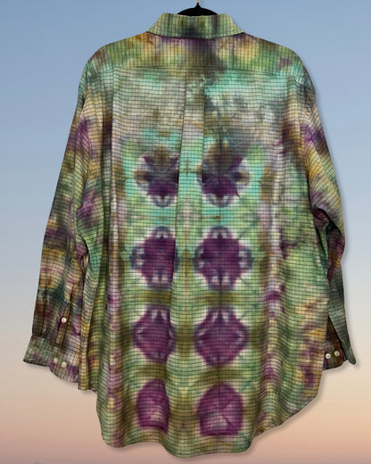 Long-sleeve tie dyed shirt with a pattern of purple shapes on a light blue background
