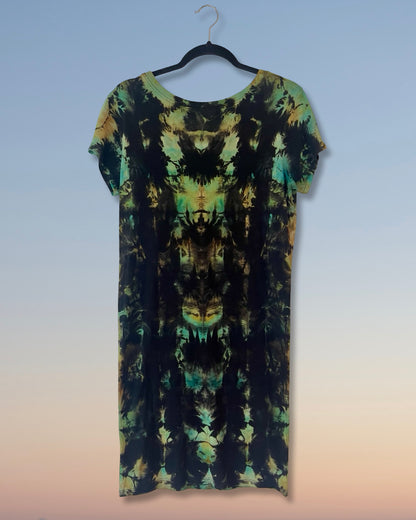 Tie-dye dress on a hanger against a gradient background