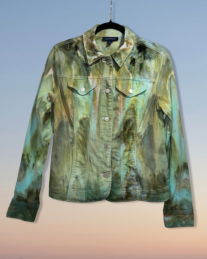 Green tie-dye jacket on a hanger against a gradient background