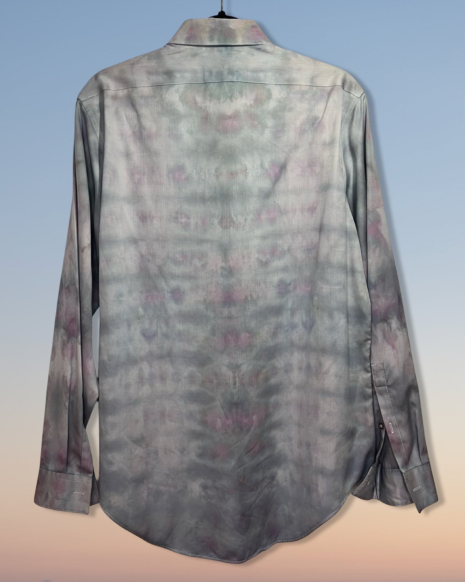 Long-sleeve shirt with a subtle tie dyepattern on a gradient background