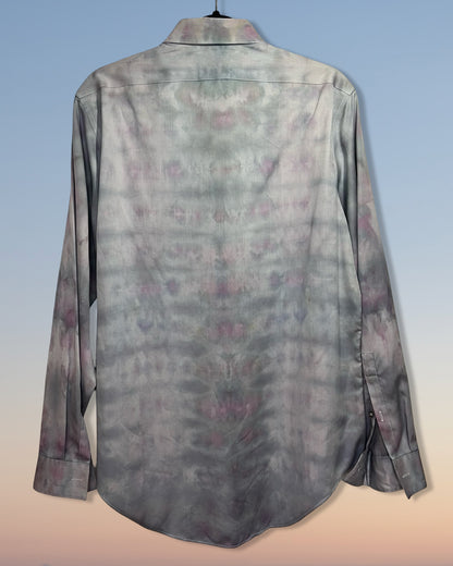 Long-sleeve shirt with a subtle tie dyepattern on a gradient background