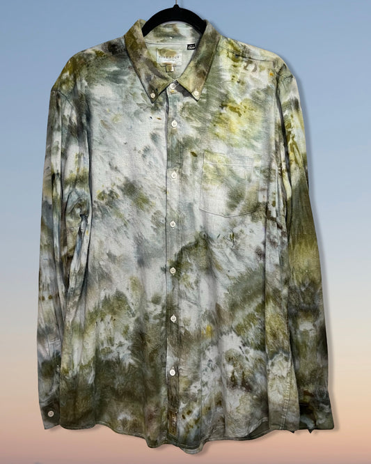 Camouflage tie dye shirt on a hanger with a gradient background