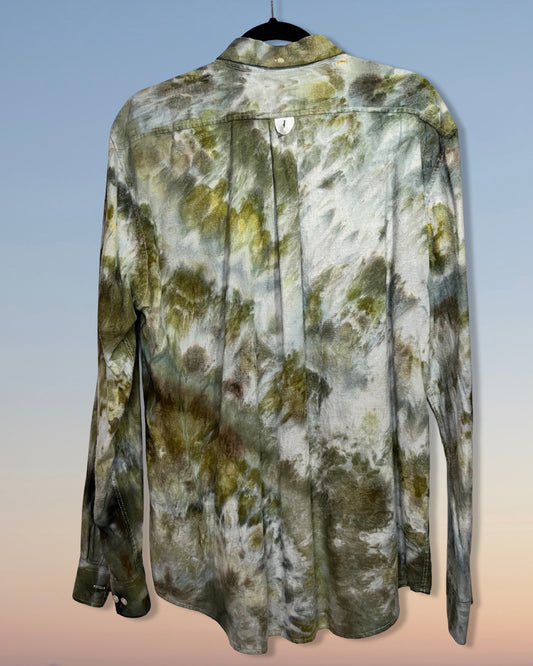 Long-sleeve shirt with a camouflage colored ice dye pattern on a gradient background